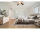 Cozy bedroom with a neutral color palette, hardwood floors, and an ensuite bathroom at 326 Seldom Seen Trl, Canton, GA 30115