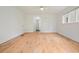 Empty bedroom with hardwood floors, white walls, white trim and large window at 326 Seldom Seen Trl, Canton, GA 30115
