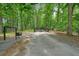 Long driveway leading through lush woods to the home at 326 Seldom Seen Trl, Canton, GA 30115