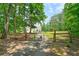 Long driveway leading to the estate, framed by a gated entrance at 326 Seldom Seen Trl, Canton, GA 30115