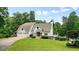 Charming two-story home features a manicured lawn, garage, and picturesque setting at 326 Seldom Seen Trl, Canton, GA 30115