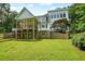 Beautiful back exterior of a white home with a multi-tiered deck overlooking yard at 326 Seldom Seen Trl, Canton, GA 30115