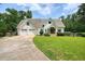 A beautiful two-story home with a well-manicured lawn and a two-car garage at 326 Seldom Seen Trl, Canton, GA 30115