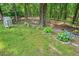 View of the garden with blooming hydrangeas and lovely greenhouse feature at 326 Seldom Seen Trl, Canton, GA 30115
