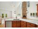 Open living room with hardwood floors, stone fireplace, high ceilings and bright light through french doors at 326 Seldom Seen Trl, Canton, GA 30115