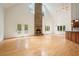 Spacious living room with a stone fireplace, French doors, and vaulted ceilings, perfect for gatherings at 326 Seldom Seen Trl, Canton, GA 30115