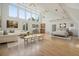 Open concept living space featuring vaulted ceilings, many windows, and hardwood floors at 326 Seldom Seen Trl, Canton, GA 30115