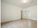Empty living room with tile floors, lots of natural light, and a neutral color palette at 326 Seldom Seen Trl, Canton, GA 30115