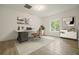 Home office featuring a modern desk, stylish decor, and bright lighting at 326 Seldom Seen Trl, Canton, GA 30115