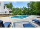 Outdoor pool area with lounge chairs, perfect for relaxing on a sunny day at 326 Seldom Seen Trl, Canton, GA 30115