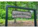 The Seldom Seen Acres sign welcomes you to the wooded property at 326 Seldom Seen Trl, Canton, GA 30115