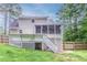 Exterior view of a well-maintained backyard deck and lawn at 19 Willowbrook Ct, Acworth, GA 30101