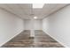 Spacious basement features wood-look flooring and recessed lighting at 19 Willowbrook Ct, Acworth, GA 30101