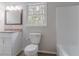 Bathroom offers a granite vanity, toilet, and tub with white accents at 19 Willowbrook Ct, Acworth, GA 30101