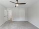 Light-filled bedroom offers neutral paint, plush carpeting, ceiling fan, and closet space at 19 Willowbrook Ct, Acworth, GA 30101