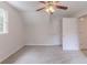 Bright bedroom features a ceiling fan and neutral carpet at 19 Willowbrook Ct, Acworth, GA 30101