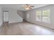Bright living room with hardwood floors, large windows, and a welcoming front door at 19 Willowbrook Ct, Acworth, GA 30101
