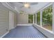 Relaxing screened patio offers outdoor living space with ceiling fan at 19 Willowbrook Ct, Acworth, GA 30101