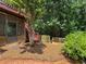 Backyard with wooded area, fenced in area, and steps at 1924 Wilkenson Xing, Marietta, GA 30066