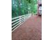 A wooded yard with a wooden fence on a home property providing privacy and security at 1924 Wilkenson Xing, Marietta, GA 30066