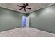Bedroom featuring neutral color walls, ceiling fan, and a doorway at 1924 Wilkenson Xing, Marietta, GA 30066
