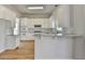 Well-lit kitchen with white cabinets, granite counters, and stainless appliances at 1924 Wilkenson Xing, Marietta, GA 30066