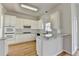 Spacious kitchen with white cabinetry, granite countertops, and stainless-steel appliances at 1924 Wilkenson Xing, Marietta, GA 30066
