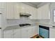 Bright kitchen with white cabinets, tile backsplash, and stainless steel appliances at 1924 Wilkenson Xing, Marietta, GA 30066