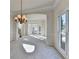 Charming living room boasts with natural light, carpet flooring, and view of staircase at 1924 Wilkenson Xing, Marietta, GA 30066
