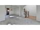 Open-concept living area with elegant staircase, chandelier, and abundant natural light at 1924 Wilkenson Xing, Marietta, GA 30066