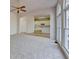 Bright living room flows to the kitchen, featuring carpet, large windows, and access to the deck at 1924 Wilkenson Xing, Marietta, GA 30066