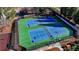 Aerial view of community tennis courts with professionally maintained green and blue surfaces at 1924 Wilkenson Xing, Marietta, GA 30066
