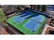 Overhead view of neighborhood tennis courts, complete with lighting and fencing at 1924 Wilkenson Xing, Marietta, GA 30066