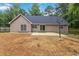 Spacious backyard featuring a patio, large yard and mature trees at 210 Riveredge Way, Mcdonough, GA 30252