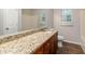 Bathroom with granite countertop, ample cabinetry and modern fixtures at 210 Riveredge Way, Mcdonough, GA 30252