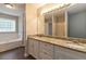 Bathroom featuring granite vanity, double sinks and a large mirror at 210 Riveredge Way, Mcdonough, GA 30252