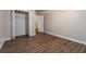 Bedroom with wood-look floors, walk-in closet and neutral paint at 210 Riveredge Way, Mcdonough, GA 30252