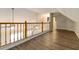 Bonus room has wood-look floors, wood trim and plenty of open space at 210 Riveredge Way, Mcdonough, GA 30252
