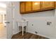 Laundry room includes a utility sink and plenty of storage space at 210 Riveredge Way, Mcdonough, GA 30252