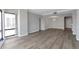 Bright, open floor plan living room with luxury vinyl plank flooring, adjacent dining area and views at 3475 Oak Valley Ne Rd # 1930, Atlanta, GA 30326