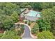 A scenic aerial view of the community clubhouse and pool, highlighting the landscaped grounds and amenities at 3638 Sope Creek Farm Se, Marietta, GA 30067