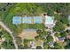 Aerial view of community amenities including tennis courts and a pool, perfect for an active lifestyle at 3638 Sope Creek Farm Se, Marietta, GA 30067