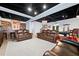 Expansive basement with a bar, pool table, and plenty of seating offers a perfect entertainment space at 3638 Sope Creek Farm Se, Marietta, GA 30067