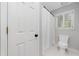 Clean bathroom with white door, toilet, shower and window at 3638 Sope Creek Farm Se, Marietta, GA 30067