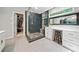 Bright bathroom featuring a glass shower and white vanity with great lighting and closet access at 3638 Sope Creek Farm Se, Marietta, GA 30067