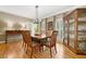 Formal dining room with hardwood floors, a display cabinet, and a stylish light fixture at 3638 Sope Creek Farm Se, Marietta, GA 30067