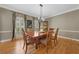 Spacious dining room featuring hardwood floors, natural light, and elegant decor at 3638 Sope Creek Farm Se, Marietta, GA 30067