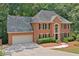 Elegant brick home featuring a manicured lawn and a welcoming entrance showcasing its classic design at 3638 Sope Creek Farm Se, Marietta, GA 30067