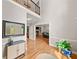 Welcoming foyer featuring hardwood floors, high ceilings, and a glimpse into the living room at 3638 Sope Creek Farm Se, Marietta, GA 30067