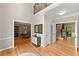 Spacious foyer with hardwood floors, staircase, and views into multiple living areas at 3638 Sope Creek Farm Se, Marietta, GA 30067